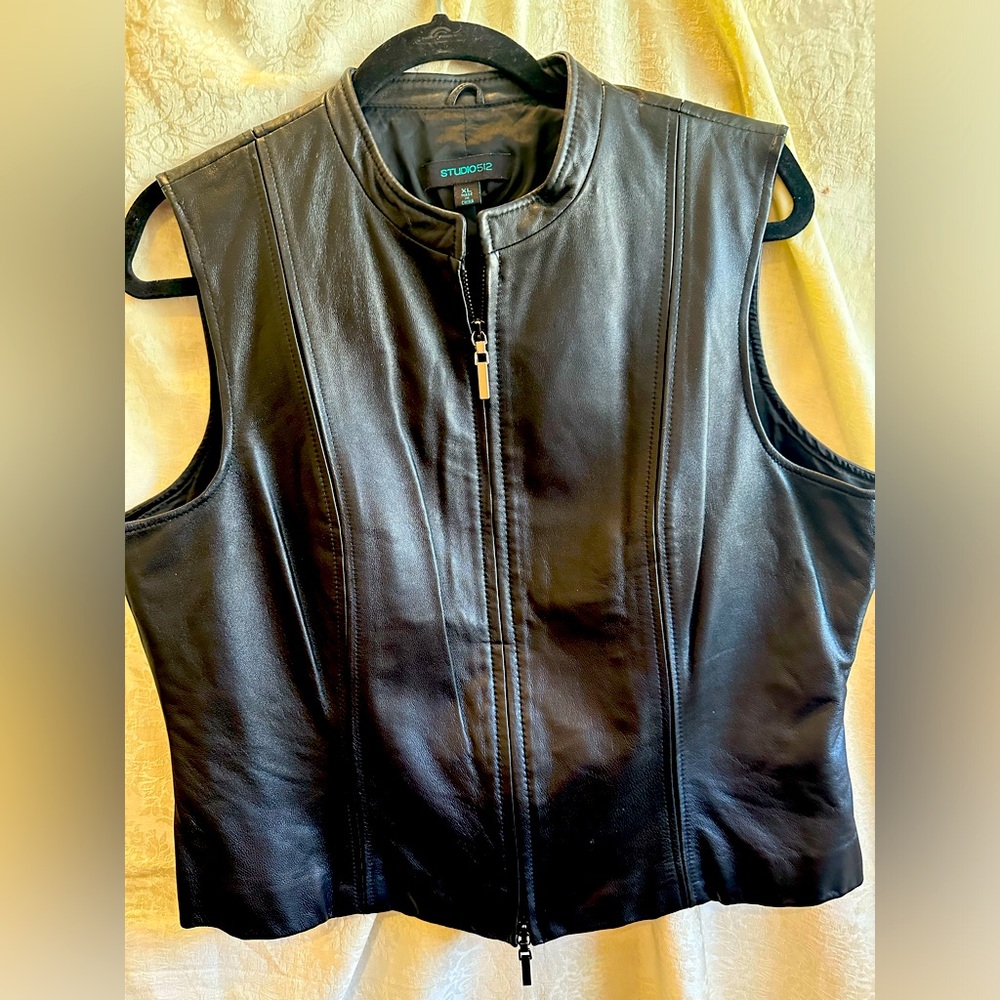 Black leather vest with zipper-seamed to fit you curves! Excellent condition!